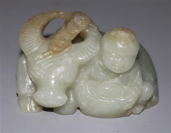 A Chinese celadon jade figure of a boy and an ox